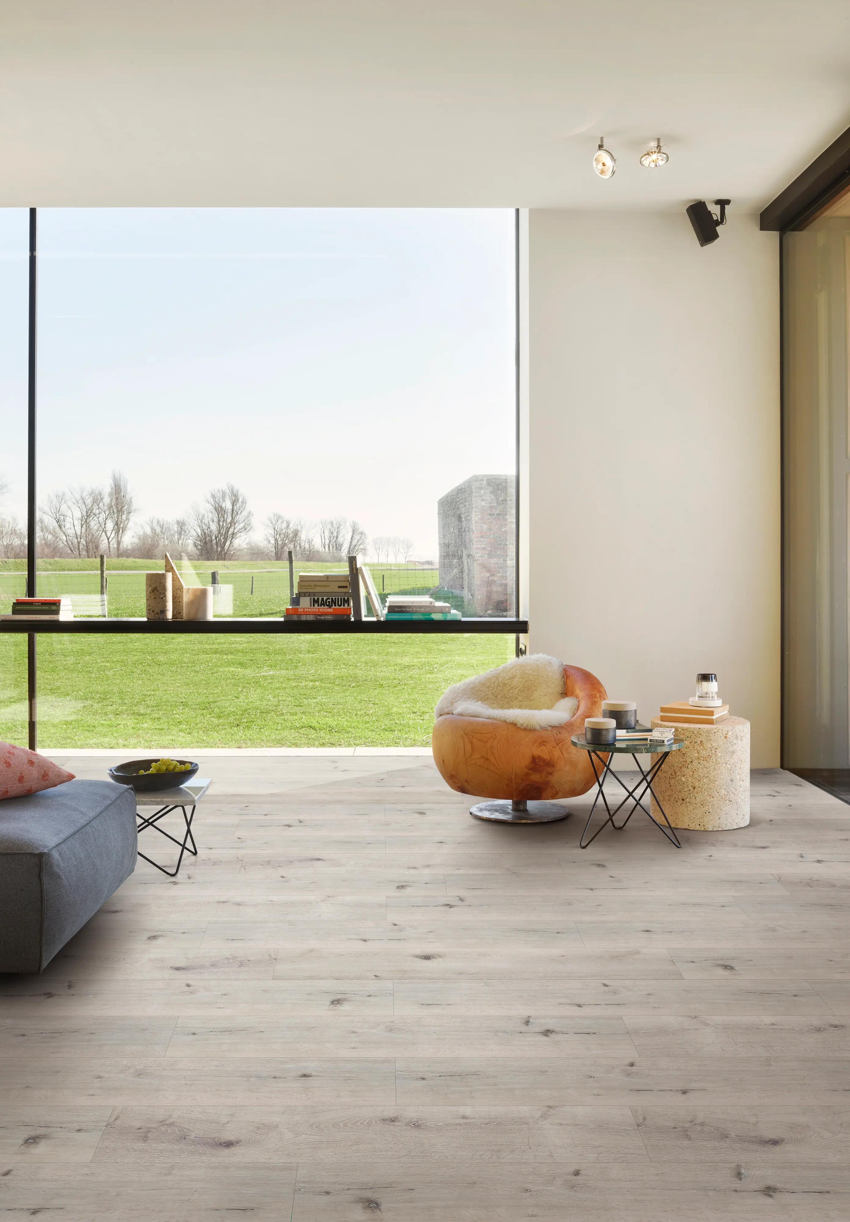 BerryAlloc Country Beige light beige luxury vinyl tile flooring in a living room