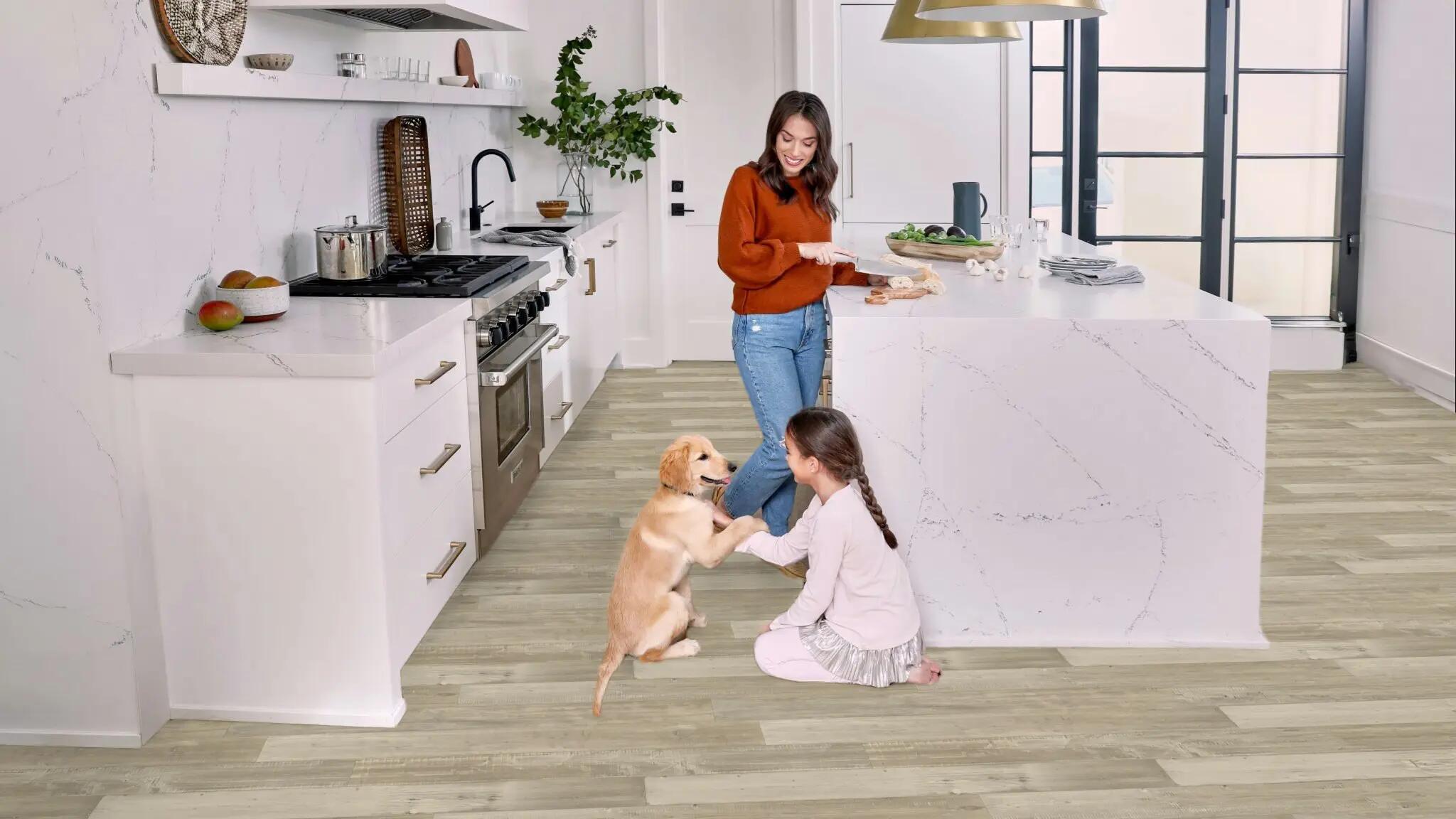 Mom daughter and puppy in kitchen